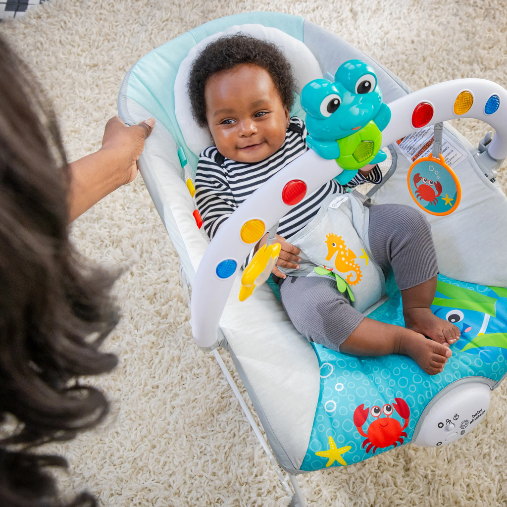BABY EINSTEIN Lehátko hudobné vibračné so svetielkami Kick to It Neptune do 9 kg