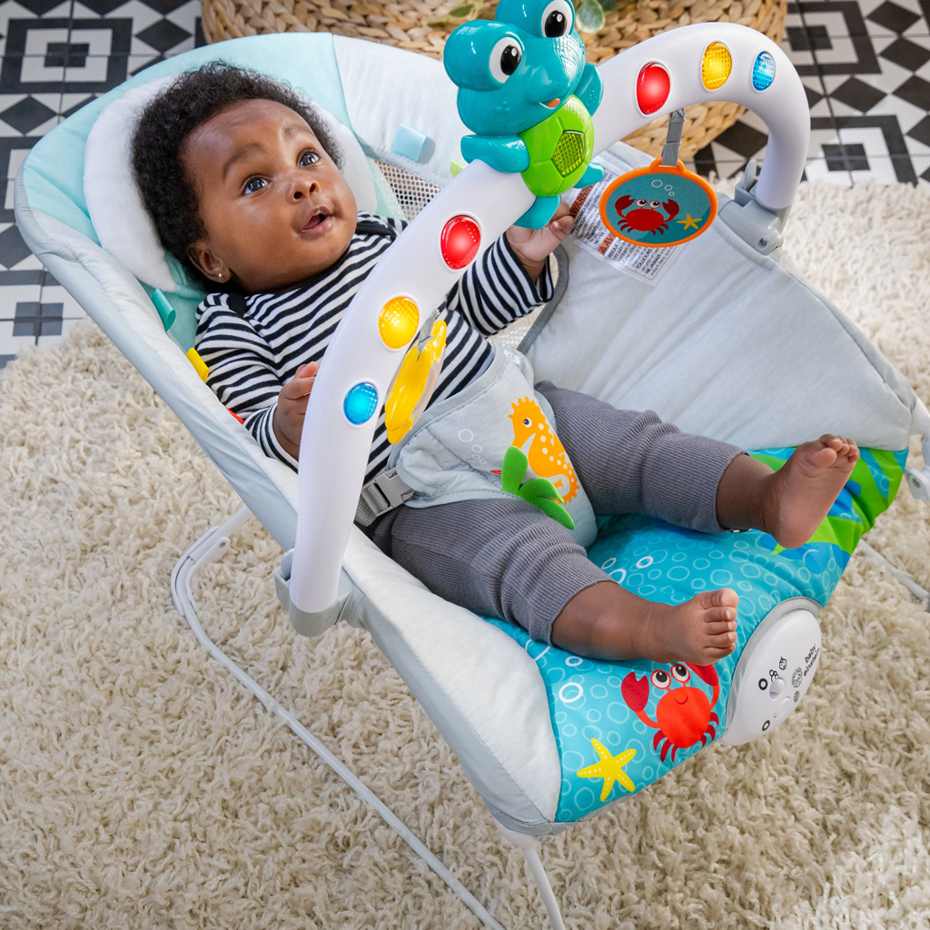 BABY EINSTEIN Lehátko hudobné vibračné so svetielkami Kick to It Neptune do 9 kg