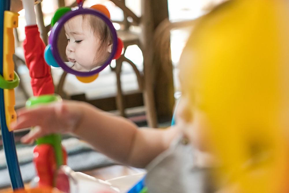 BABY EINSTEIN Skákadlo/aktívne centrum 2v1 Neighborhood Symphony 6m+ do 11 kg