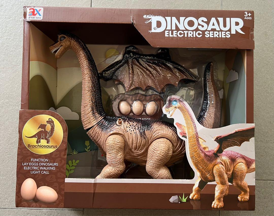 Dinosaurus na batérie kladúce vajcia